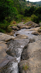 Waterfall and rocks landscape view