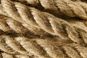 Jute rope in a skein close-up. Background made of natural organic threads. Macro shot. Environmentally friendly Material for creativity. Made from the Corchorus capsularis plant.