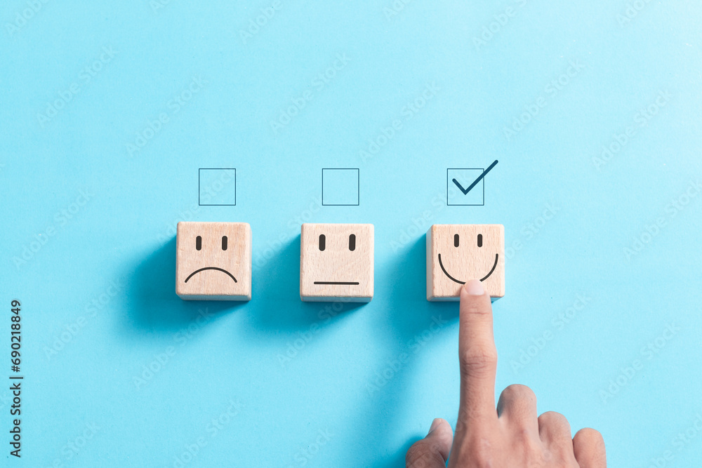 Poster hand touch wooden block with smiling face for for customer evaluation and best excellent after use p