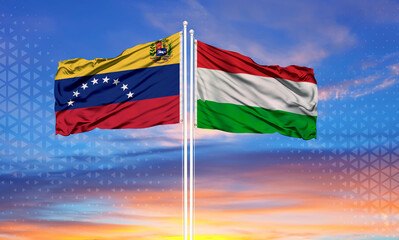 Sunny blue sky and flags of venezuela and hungary