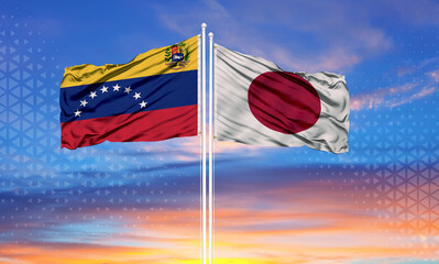 Venezuela and Japan two flags on flagpoles and blue sky