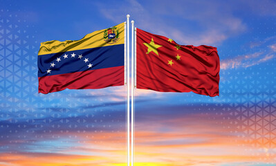 Venezuela and china two flags on flagpoles and blue cloudy sky . Diplomacy concept, international relations