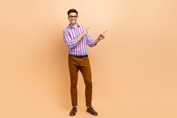 Full length photo of attractive cheerful man wear trendy clothes presenting novelty proposition...