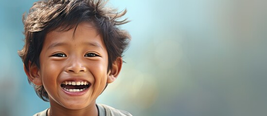 Little Southeast Asian boy with dental problems smiling showing his tooth caries and cavities. Website header. Creative Banner. Copyspace image