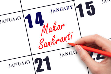January 14. Hand writing text Makar Sankranti on calendar date. Save the date. Holiday.  Day of the...