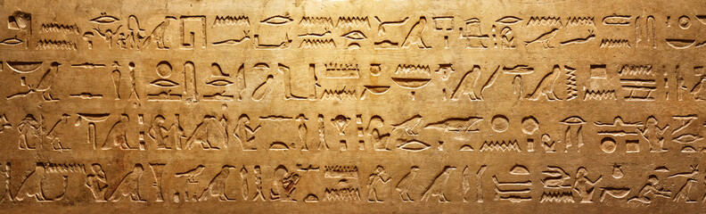 Old Egyptian hieroglyphs on an ancient background. Wide historical and culture background. Ancient...