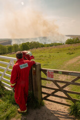 Fire Ranger with hose in the North of England during a Moor Fire
