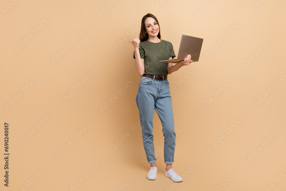 Sticker Full body photo of lady sales manager on amazon shopify service using laptop point finger mockup prices isolated over beige color background