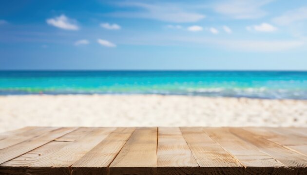 The wood table top on blurred blue sea and white sand beach background