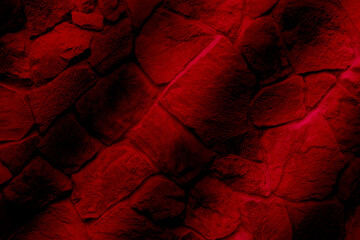 Red black stone wall background texture.
