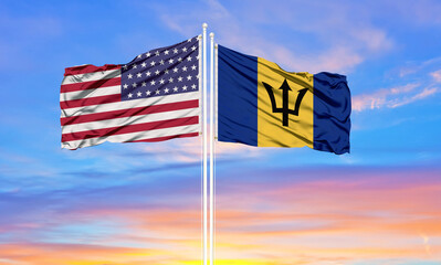 United States and Barbados two flags on flagpoles and blue cloudy sky . Diplomacy concept, international relations - obrazy, fototapety, plakaty