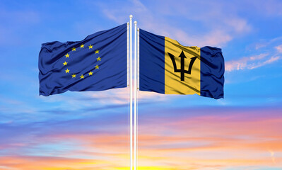 European Union and Barbados two flags on flagpoles and blue cloudy sky . Diplomacy concept, international relations - obrazy, fototapety, plakaty