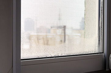 Drops of condensation in winter on the window