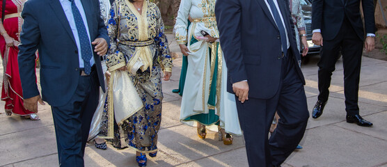 Moroccan wedding. Women wear caftans and men wear tuxedos