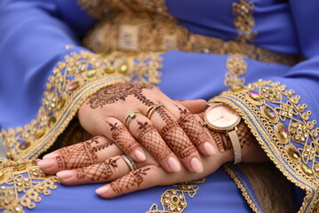 mehendi on the hands of girls,Woman Hands with black mehndi tattoo. Hands of moroccan bride girl...