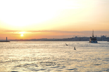 Fototapeta na wymiar Old town, seagulls and sunset from Kadikoy