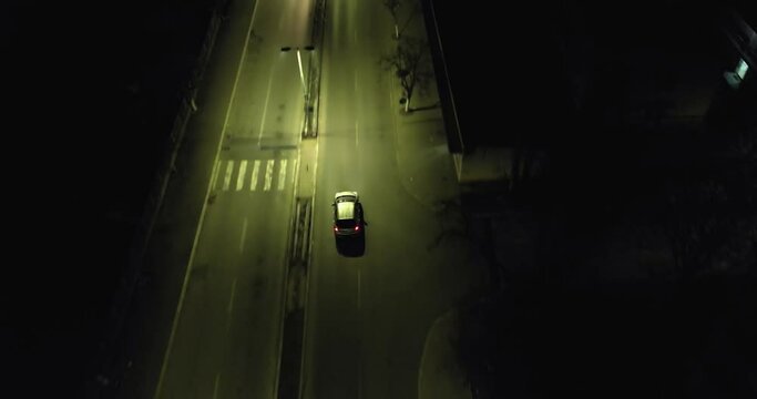 Car make illegal traficking driving on illuminated street at night