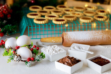 Ingredients for making christmas cookies with jam.