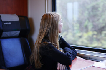 Girl on the train looking out the window