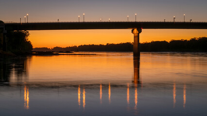 silhouette of the bridge over Missouri River at Hermann, MO, after sunset