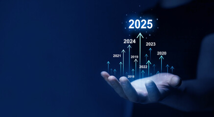 Businessman draws increase arrow graph corporate future growth year 2024 to 2025....