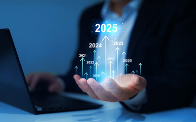 Businessman draws increase arrow graph corporate future growth year 2024 to 2025....