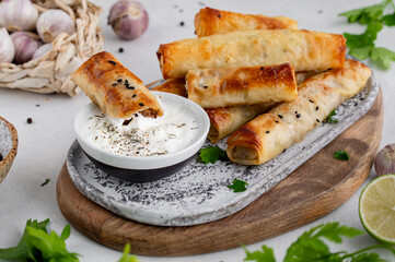 Turkish Cigara Börek (Sigara böreği) or Cigarette Pastry with Spinach and Feta Cheese with...