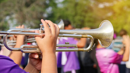 Music instrument is being played by hands