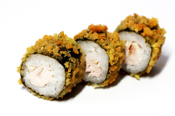 Three fried rolls on a white background