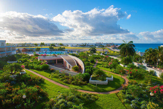 Royal Islander Club Resort La Terrasse garden with Princess Juliana International Airport SXM near Maho Beach on Sint Maarten, Dutch Caribbean. 