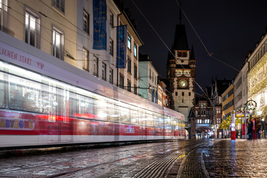 Freiburg im Breisgau, Germany, November 30, 2023: A tram moves towards Martinstor on Kaiser-Joseph-Straße.  