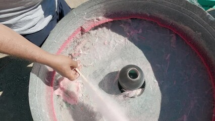 Pouring sugar into cotton candy machine - Powered by Adobe