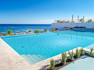 Swimming pool with sea view - obrazy, fototapety, plakaty