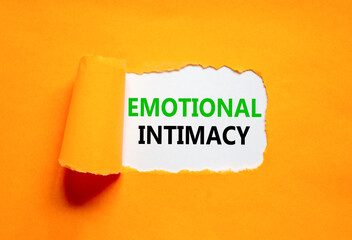 Emotional intimacy symbol. Concept words Emotional intimacy on beautiful white paper. Beautiful orange paper background. Psychology emotional intimacy concept. Copy space.