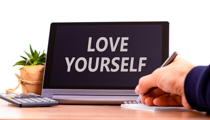 Love yourself symbol. Concept words Love yourself on beautiful black tablet. Beautiful white background. Calculator. Psychologist hand. Psychology love yourself concept. Copy space.