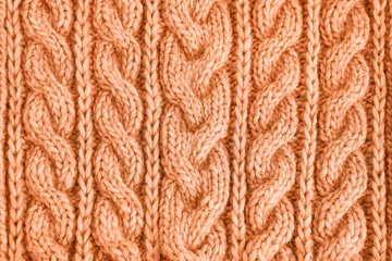 Peach fuzz color knitted texture. Handmade Knitwear. Background