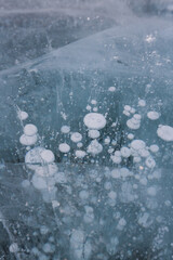 Gas methane bubbles frozen in blue ice of lake Baikal