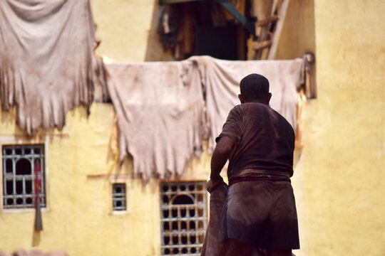 Man working in the tannery in Fez