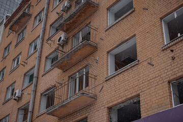 KYIV, UKRAINE - DECEMBER 8, 2023: IN MARCH 2022, THE RUSSIANS KISSED THE CITY CENTER WITH A ROCKET. GOT INTO THE HOUSE. ONE BUILDING WAS NOT RESTORED, WINDOWS WERE INSERTED IN OTHERS.