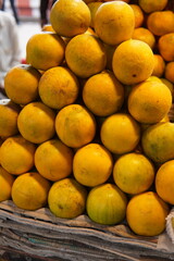 Many sweet lime  are arranged for sale. Bunch of sweet lemon. Kemon in market. Sweet lime.