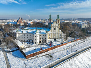 Skalka. St. Stanislaus church and Paulinite monastery in Krakow, Poland, in winter. Historic burial place of distinguished Poles. Aerial view with boulevard and promenade, surrounding wall and snow