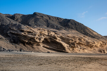 Ventifact rock formations caused by wind at La Pared Beach, Fuerteventura