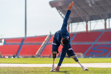 Sport man athlete with a prosthesis on his leg action of warm-up the body with stand and  do tab...
