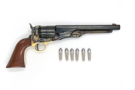Black powder revolver Colt Army 1860 and the paper cartridges on a white background. Right side.