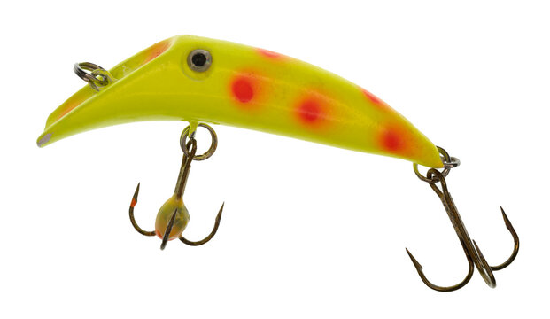 Macro image of a bright yellow fishing lure that has orange spots a silver / black &ldquo;eye&rdquo;. The lure has two treble hooks.  On a clean background.
