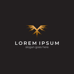 Obraz premium Abstract eagle logo vector in gold color with black background