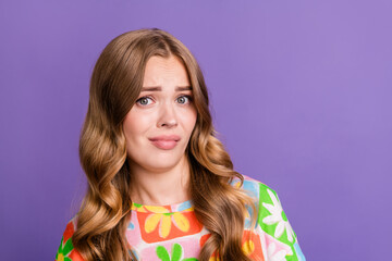 Portrait of unhappy dissatisfied girl with curly hairdo dressed print t-shirt staring at camera...