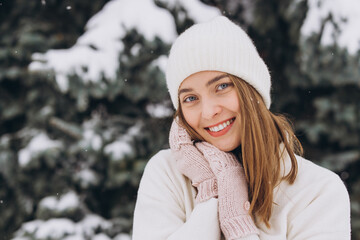 Portrait of a happy beautiful girl in a winter