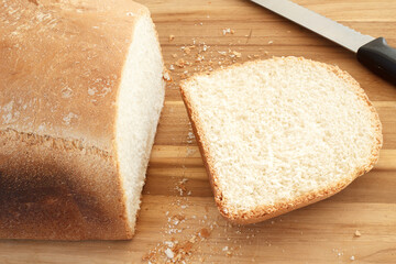 Homemade loaf of bread on cutting board