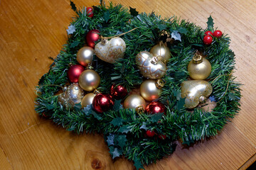 Decoration for Advent and Christmas: various balls between garlands made of conifer branches